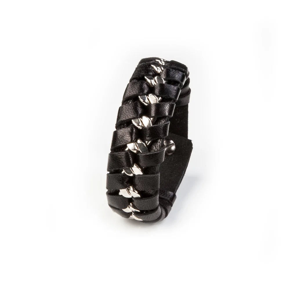 Men's black braided leather bracelet featuring an interwoven silver-tone chain accent, wide cuff design, and magnetic clasp closure for a bold contemporary luxury look.