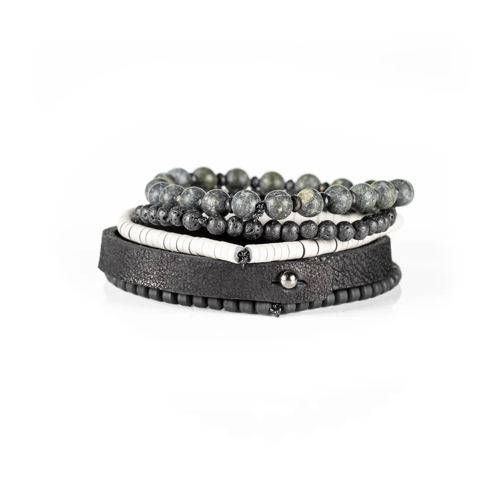Men's handcrafted black leather wrap bracelet set featuring natural green jasper gemstone beads, black lava stone beads, matte black beads, white heishi disc beads, and premium layered leather. Luxury men's stacked bracelet photographed on a clean white background.