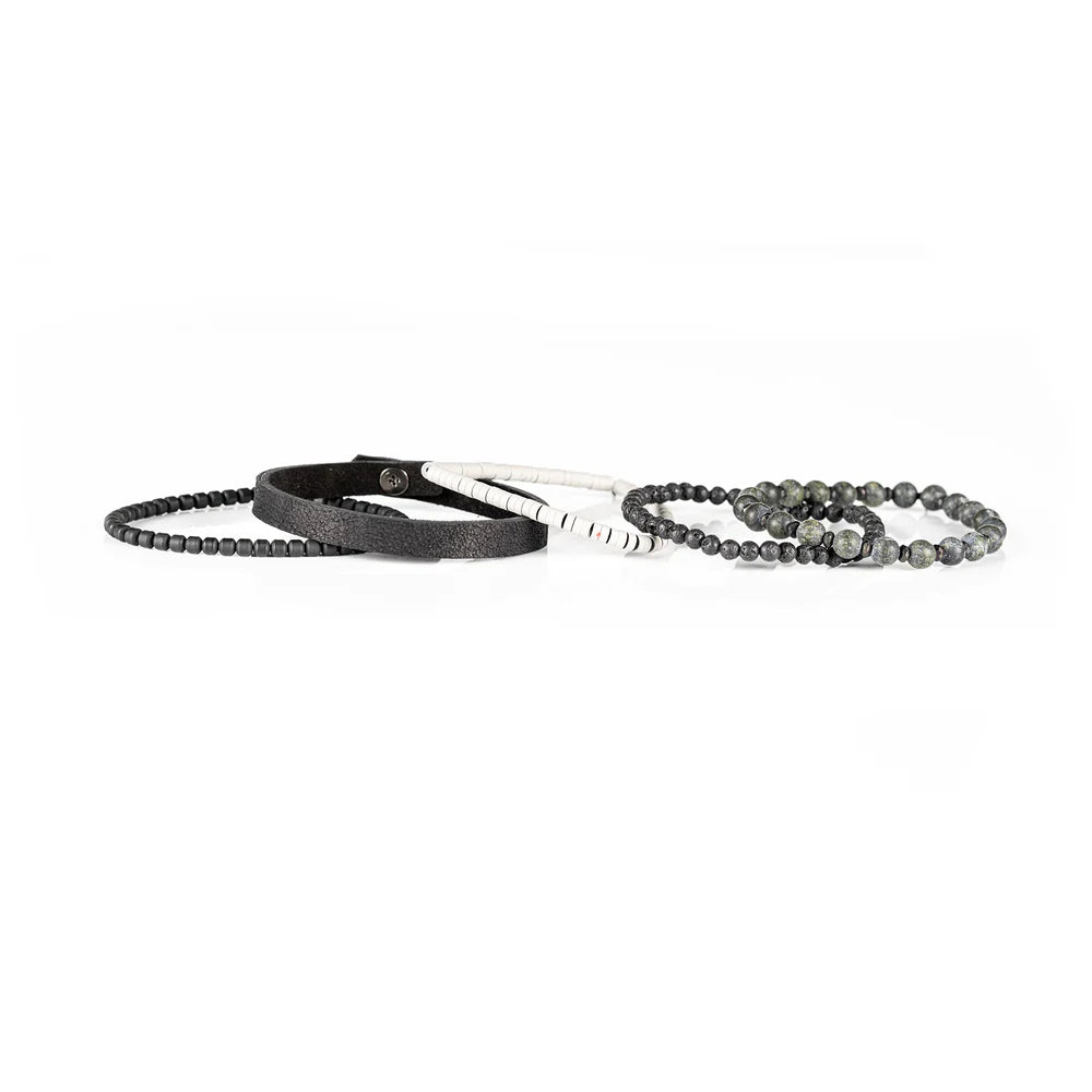 Men's handcrafted black leather wrap bracelet set featuring natural green jasper gemstone beads, black lava stone beads, matte black beads, white heishi disc beads, and premium layered leather. Luxury men's stacked bracelet photographed on a clean white background.