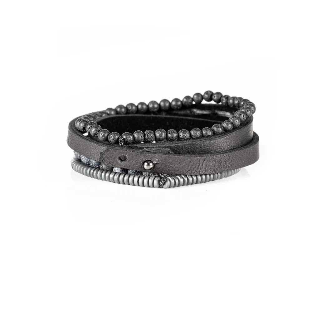 Men's handcrafted layered bracelet set featuring a black genuine leather wrap cuff, black lava stone beads, natural gray crackle agate gemstone beads, matte gray heishi disc beads, and premium stitched leather detailing. Luxury men's stacked bracelet photographed on a clean white background.
