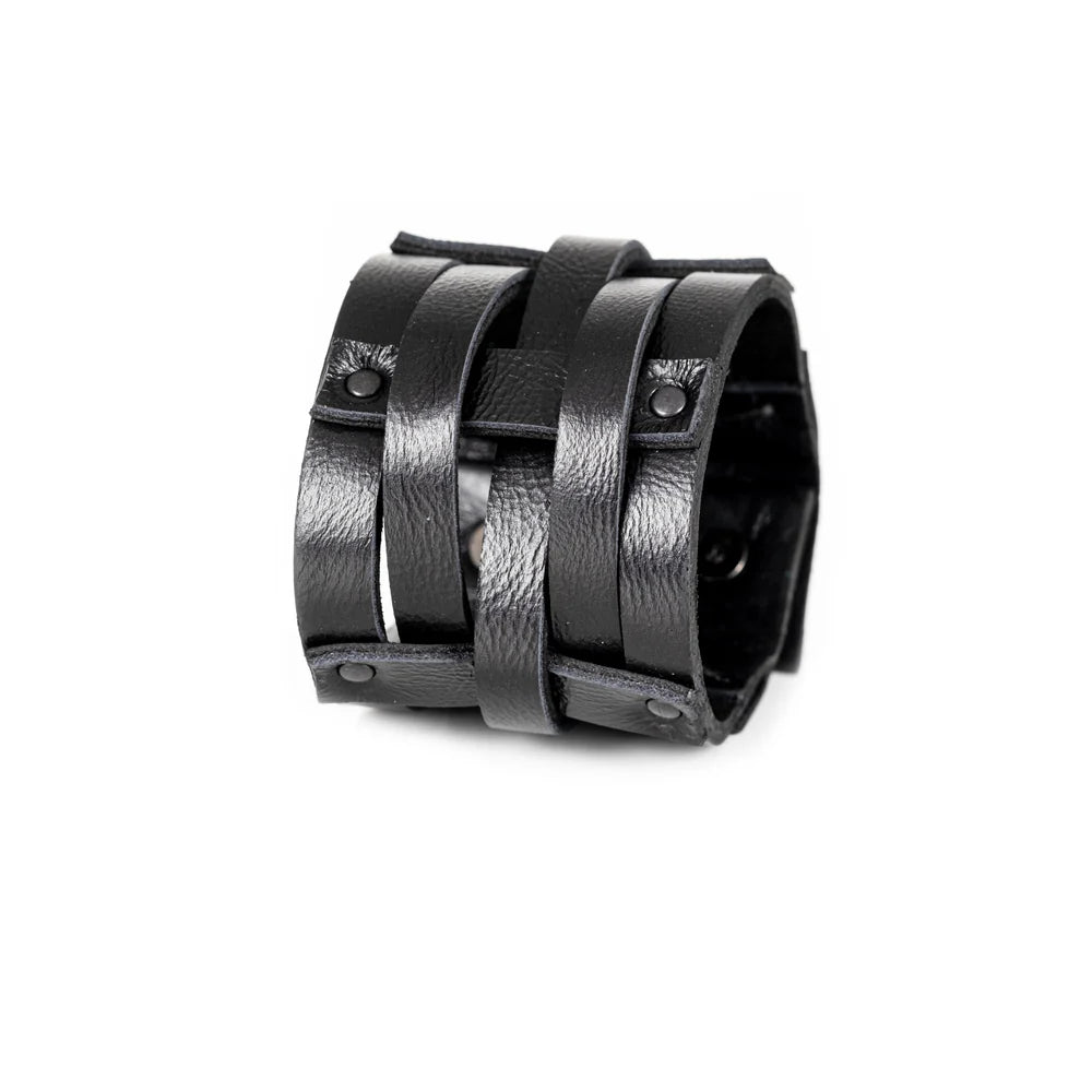 Black genuine leather cuff bracelet featuring an open cage design with layered leather straps and black rivet accents, handcrafted statement accessory on a white background.