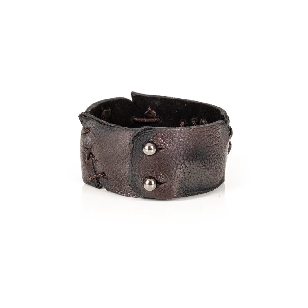 Black genuine leather cuff bracelet with hand-laced stitch detailing, raw cut edges, and a handcrafted artisan design, displayed on a white background.