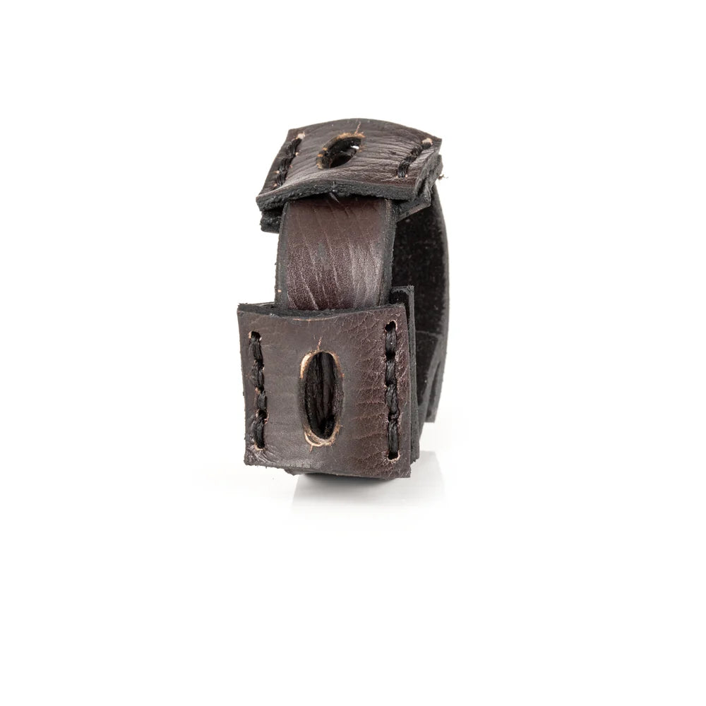 Black genuine leather cuff bracelet featuring layered square leather panels with oval cutout details and hand-stitched accents, handcrafted artisan statement accessory on a white background.