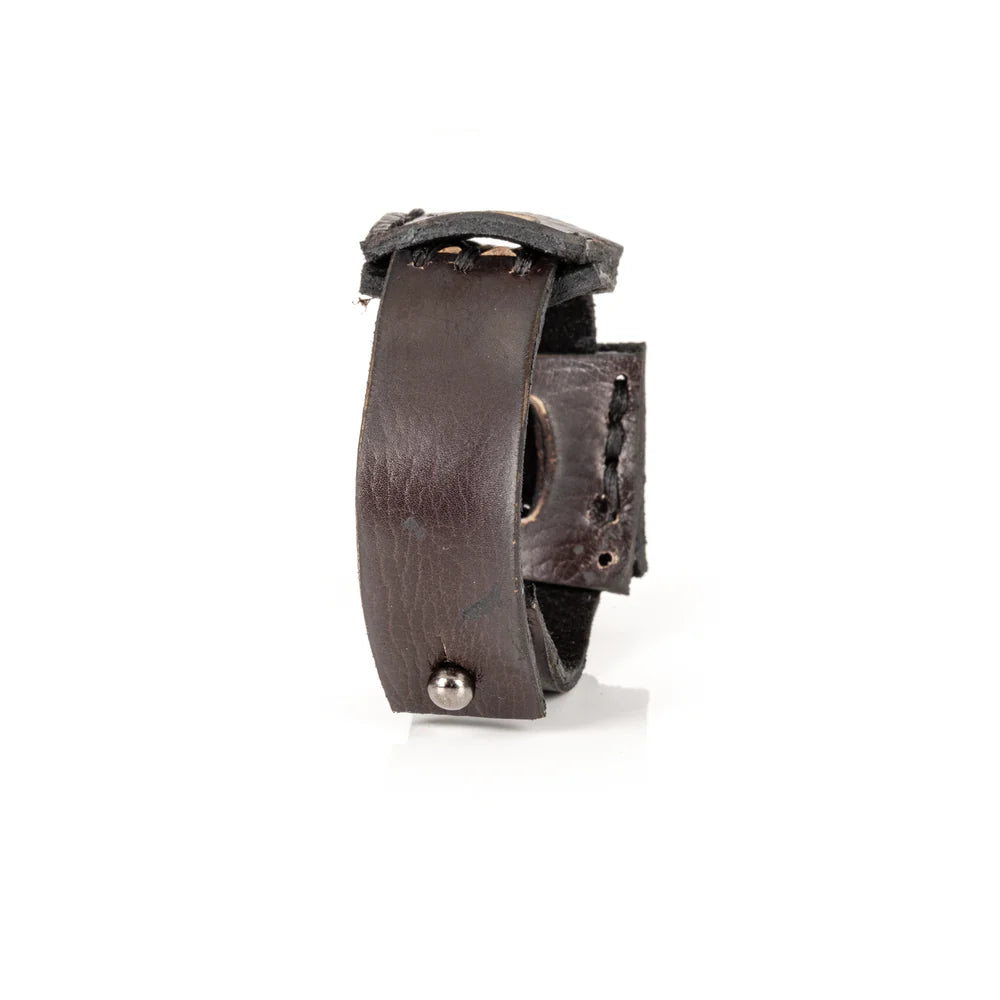 Black genuine leather cuff bracelet featuring layered square leather panels with oval cutout details and hand-stitched accents, handcrafted artisan statement accessory on a white background.