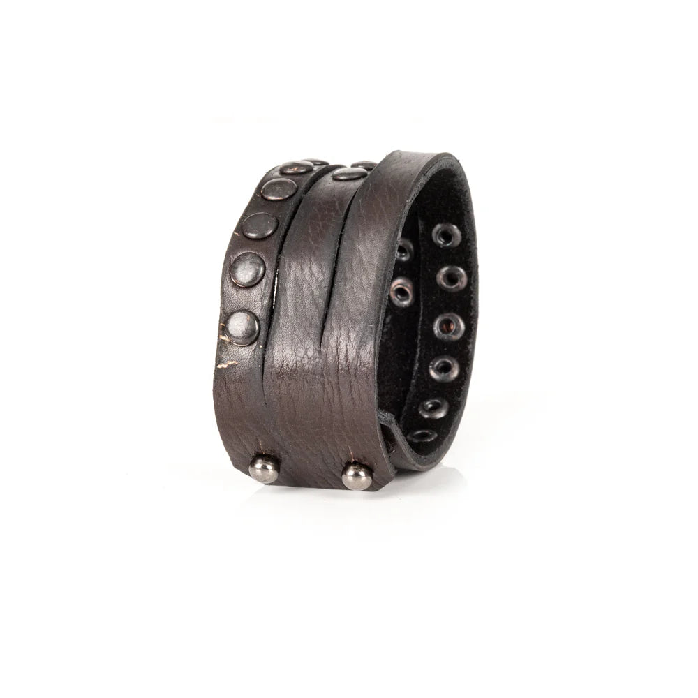 Black genuine leather wrap bracelet featuring layered leather bands with black rivet detailing and a handcrafted rugged design, displayed on a white background.
