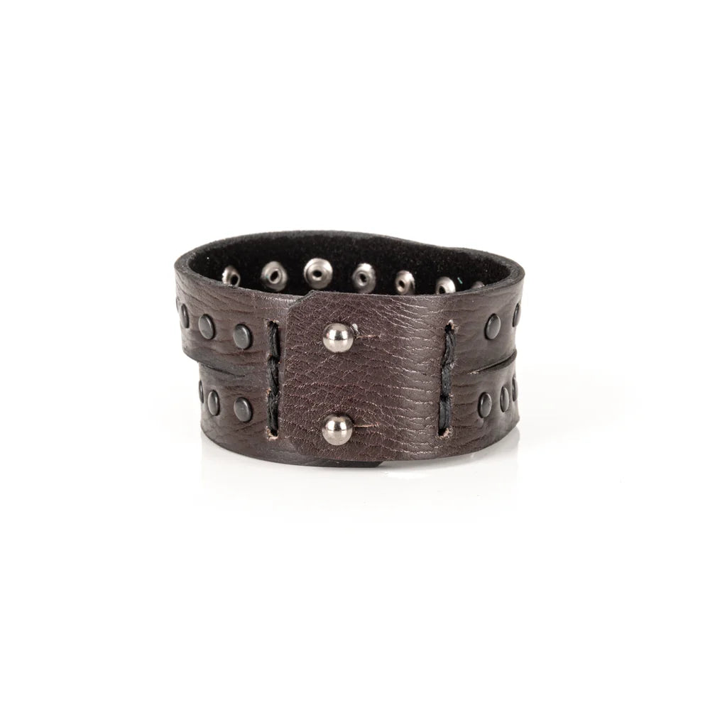 Black genuine leather wrap bracelet featuring double leather bands with black rivet detailing, handcrafted statement accessory with a rugged minimalist design, displayed on a white background.