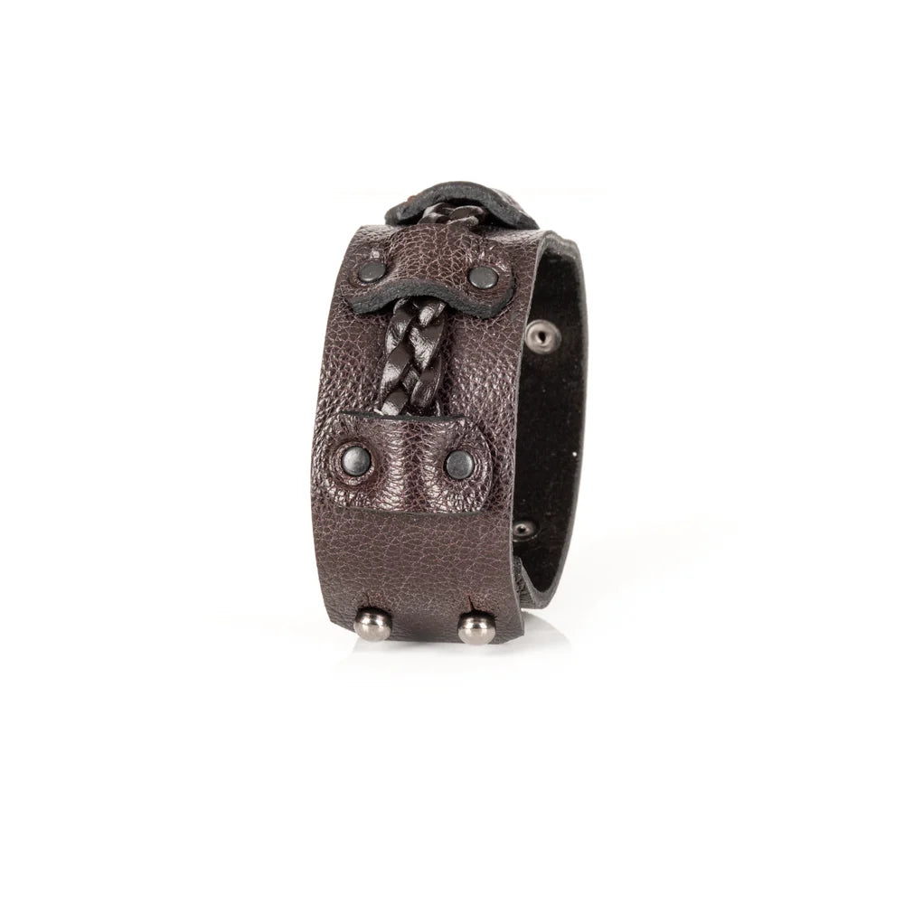 Men's handcrafted genuine leather cuff bracelet in dark brown featuring a wide leather band with a braided leather center strap, matte black rivet accents, and premium artisan craftsmanship. Luxury men's leather wristband photographed on a clean white background.