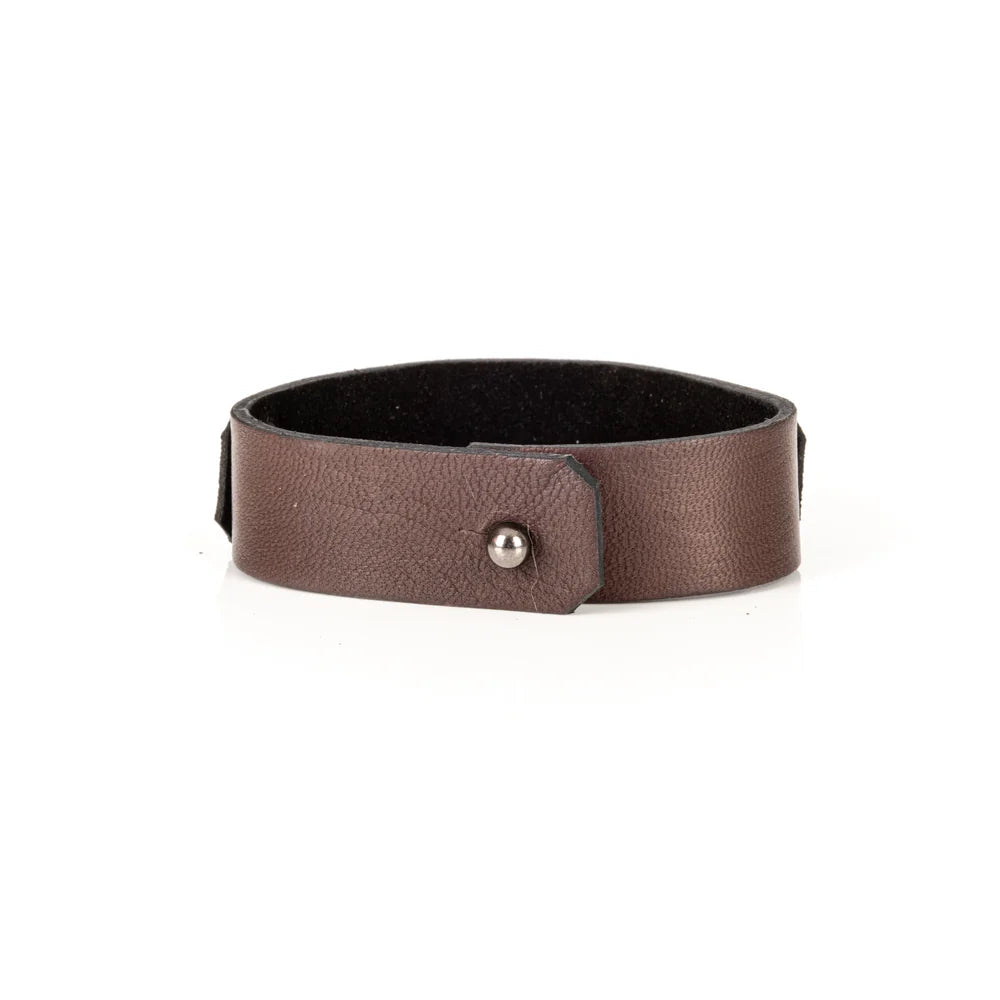 Men's handcrafted genuine leather cuff bracelet in dark brown featuring a wide minimalist design with black rivet hardware, hand-stitched razor blade accent, and premium artisan craftsmanship. Luxury men's leather wristband photographed on a clean white background.