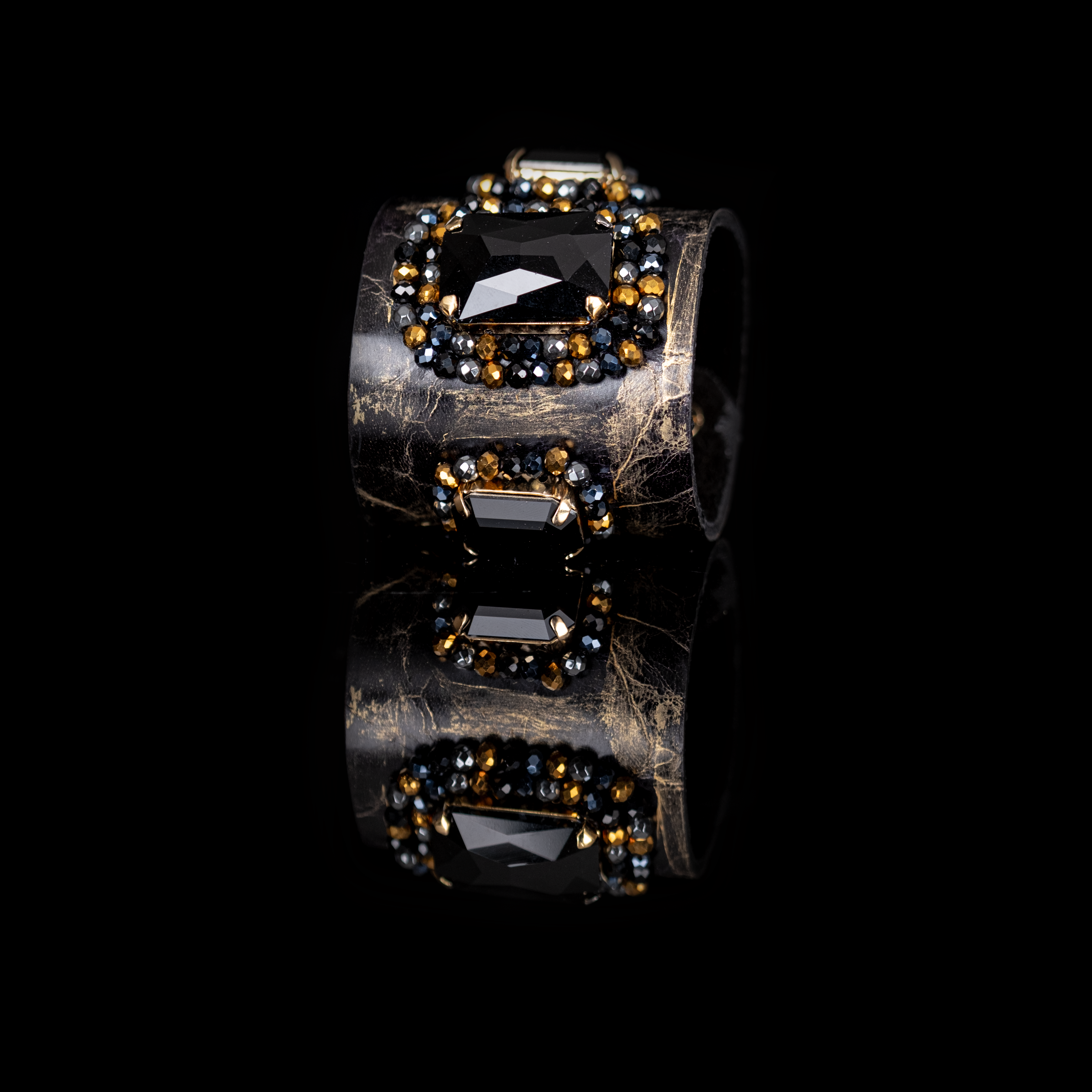 Black leather cuff bracelet with large black faceted crystal and gold bead embellishments, handmade statement bracelet by THE DARK