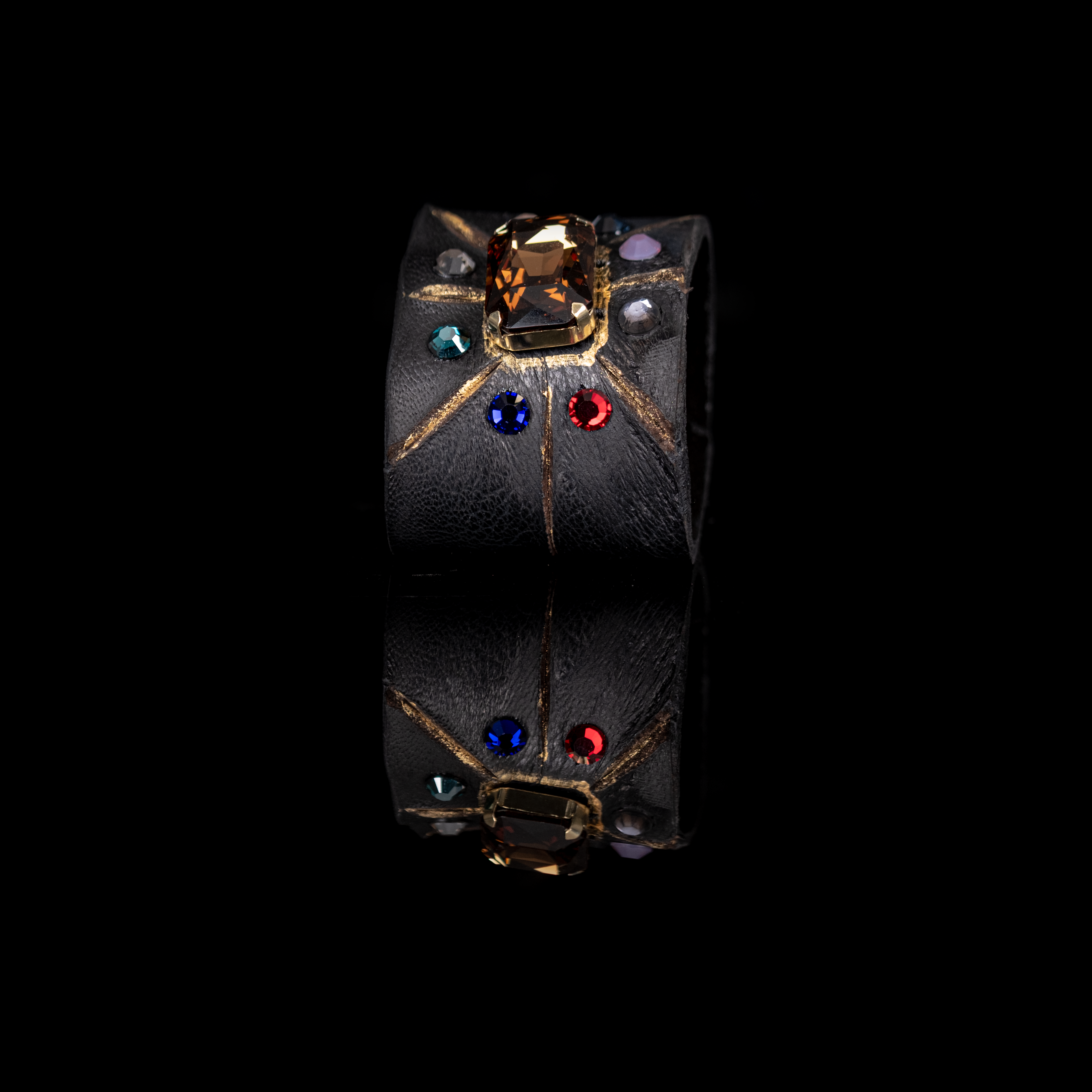Black leather cuff bracelet with amber crystal centerpiece and multicolor gemstone accents, handmade statement bracelet by THE DARK