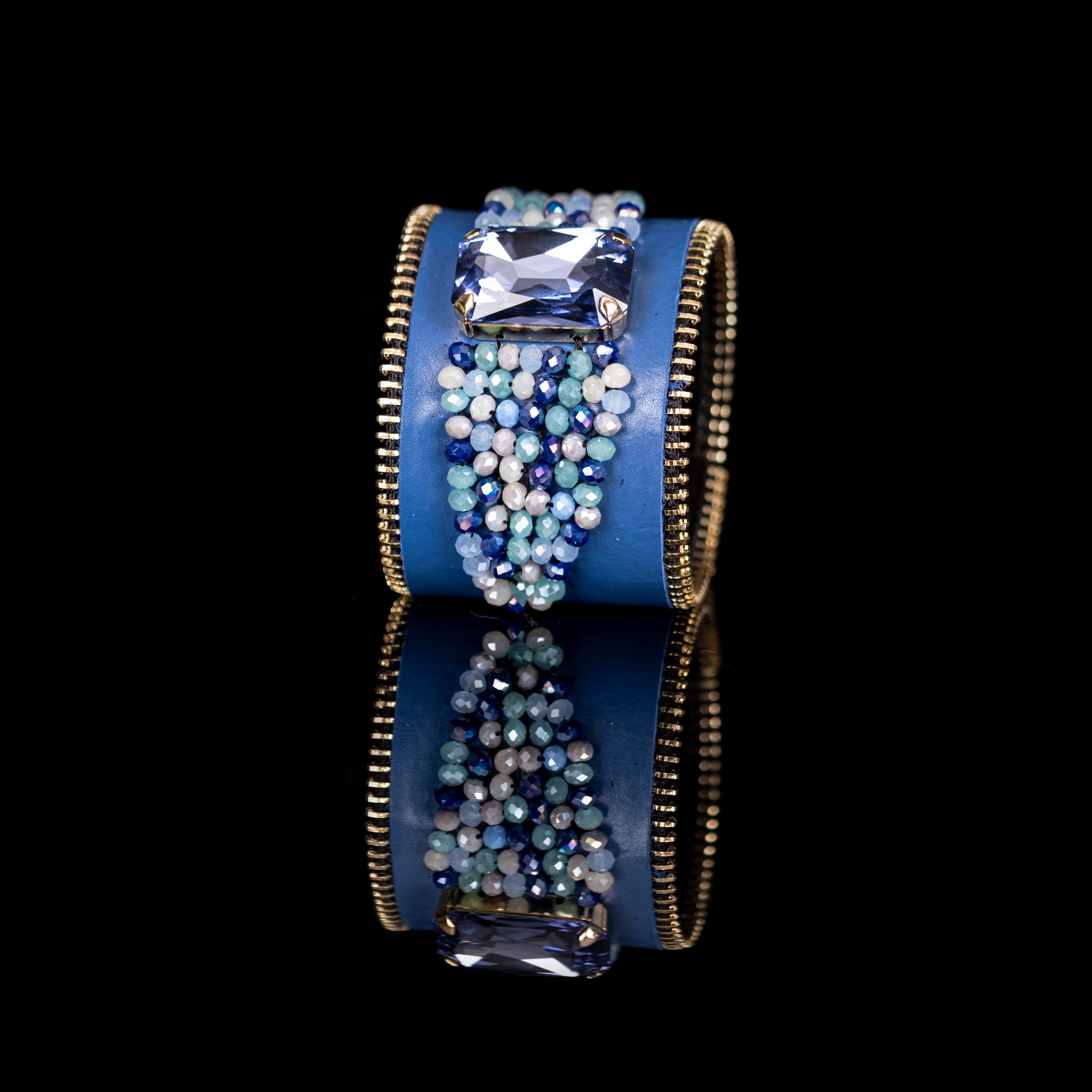 Blue leather cuff bracelet with rectangular crystal and cascading blue bead detail