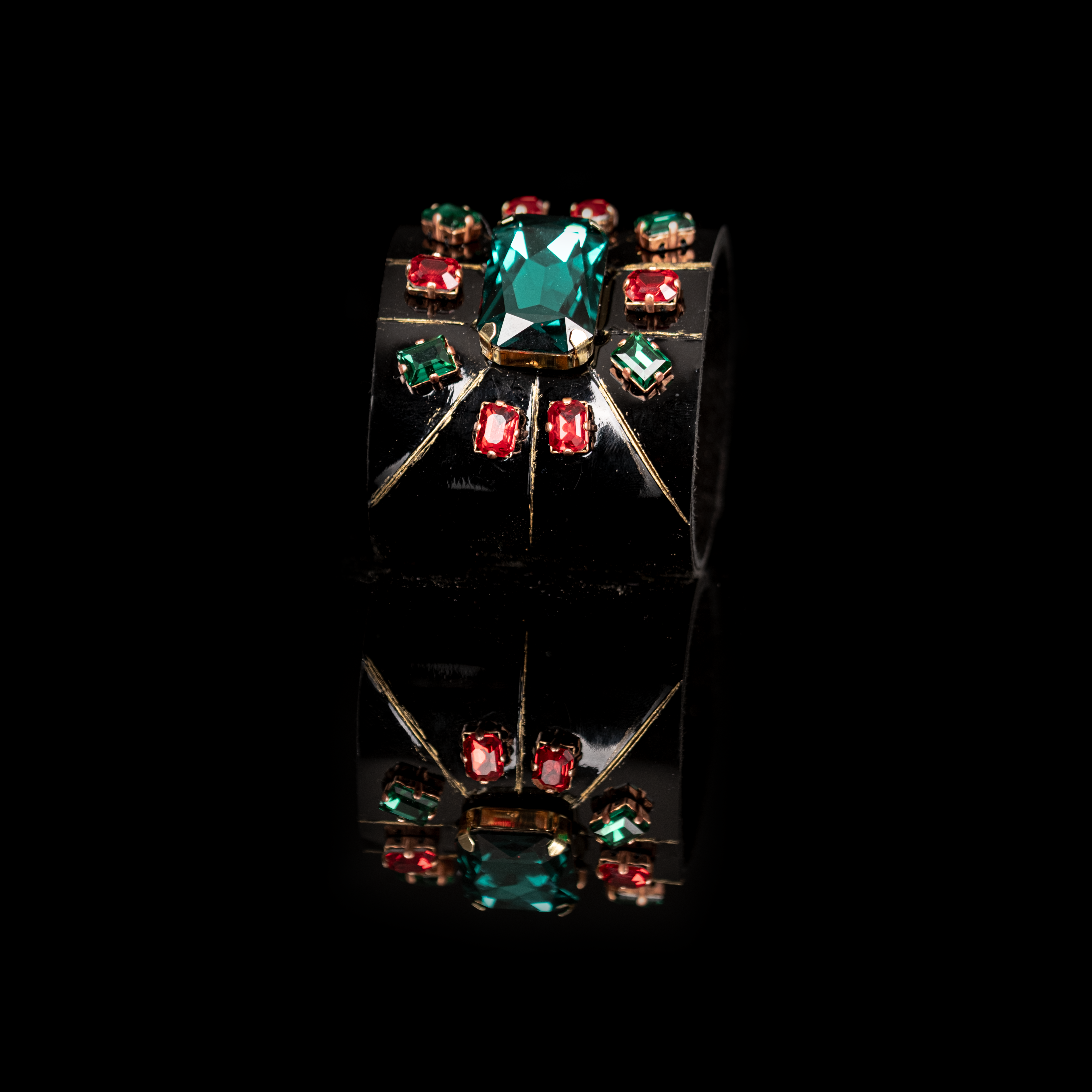 Black leather cuff bracelet with green center crystal and red gemstone accents, gold geometric statement bracelet for women