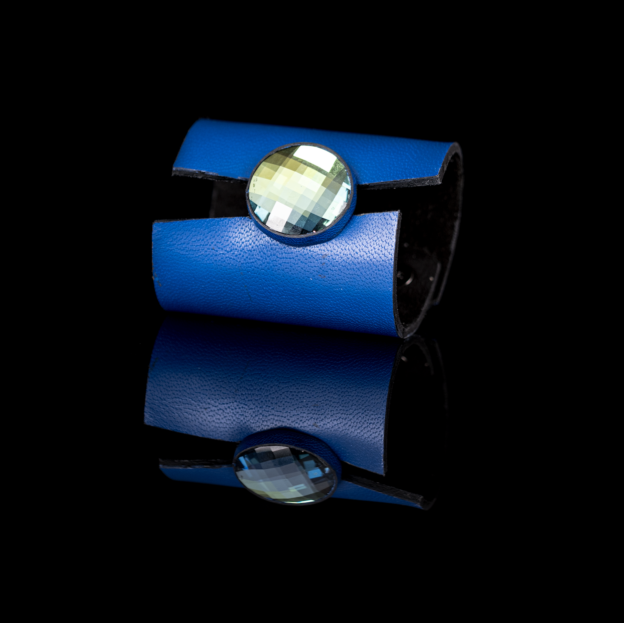 Blue leather cuff bracelet with large faceted crystal centerpiece