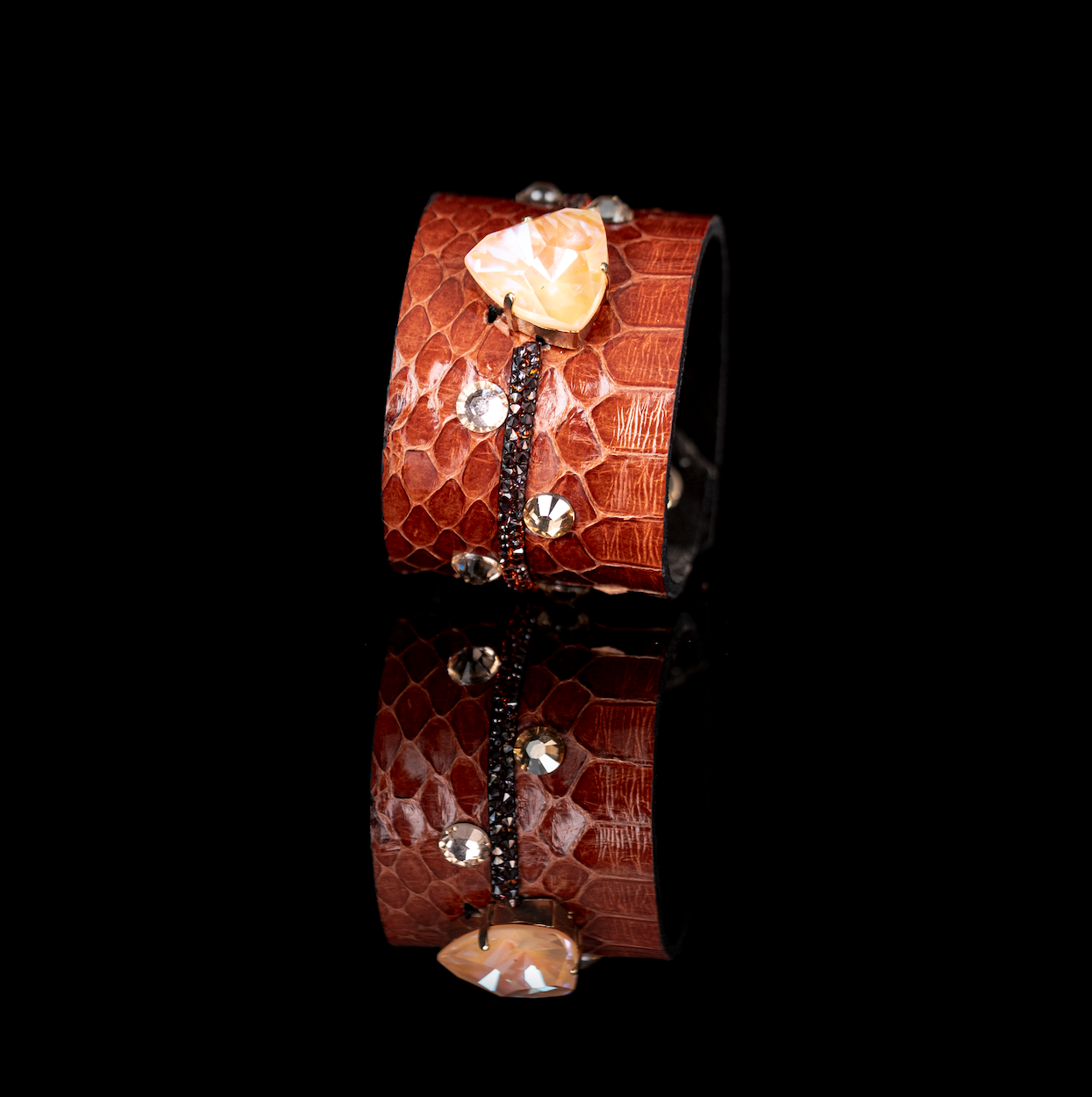 Burnt orange python leather cuff with amber crystal centerpiece and scattered stones