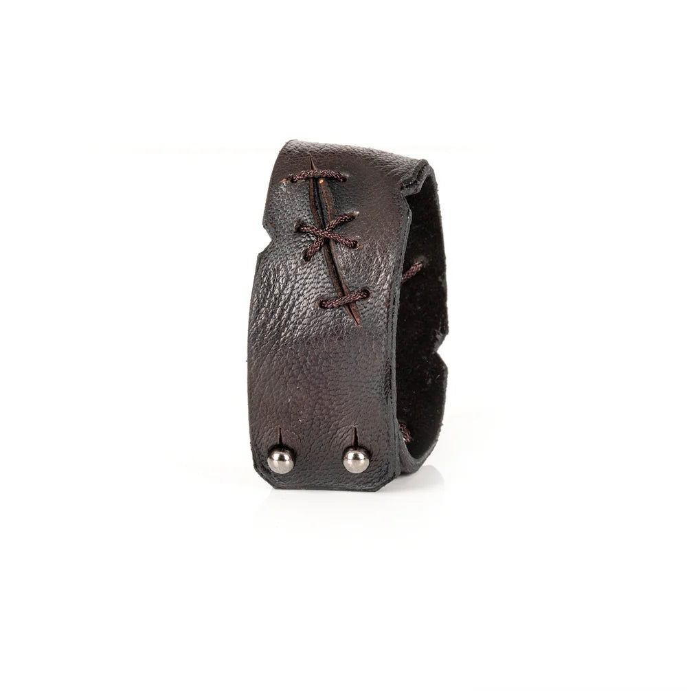 Black genuine leather cuff bracelet with handcrafted lace-up stitching details, rugged artisan finish, and a wide statement silhouette, displayed on a white background.