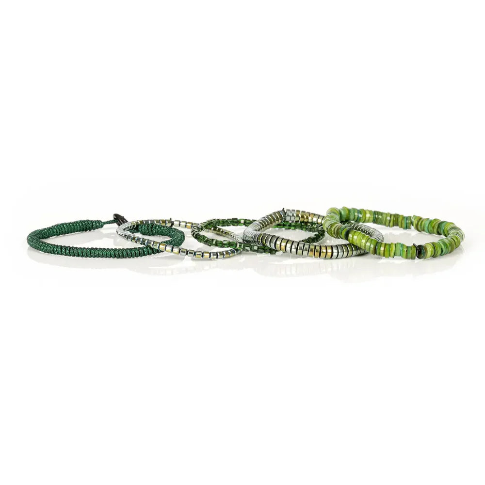 Layered men’s bracelet set featuring green shell heishi beads, metallic hematite beads, faceted dark green crystal beads, and a braided green cord bracelet, displayed on a white background.