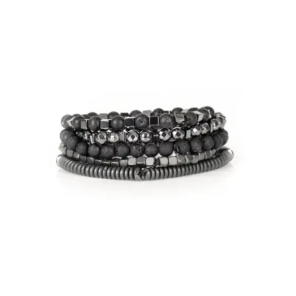 Layered men’s bracelet set featuring black lava stone beads, faceted hematite beads, hematite cube accents, and matte hematite disc beads in a monochromatic stacked design, displayed on a white background.