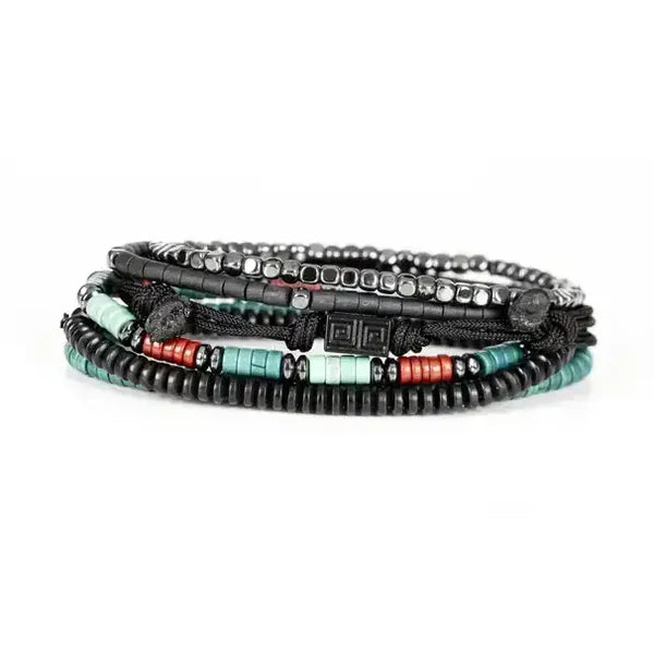 Layered men’s bracelet set featuring black hematite beads, turquoise and coral heishi bead accents, black braided cord details, and geometric metal elements, displayed on a white background.