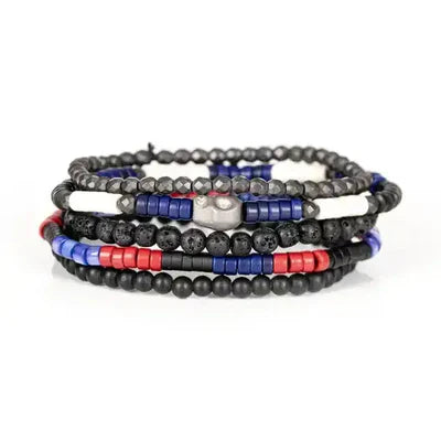 Layered men’s bracelet set featuring black matte beads, lava stone beads, faceted hematite beads, and red and blue accent beads with a silver-tone centerpiece, displayed on a white background.
