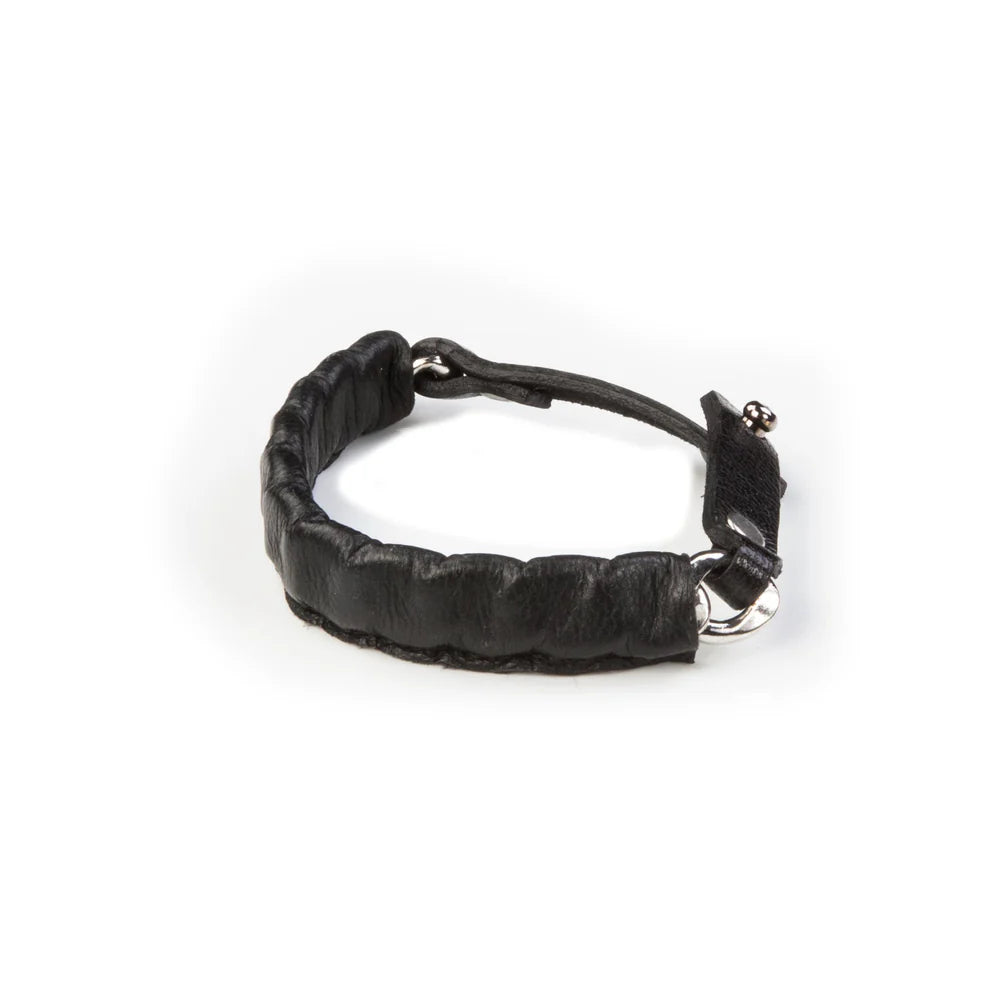 Men's black leather wrap bracelet featuring a padded stitched band, adjustable leather strap, and silver-tone hardware for a rugged modern look.
