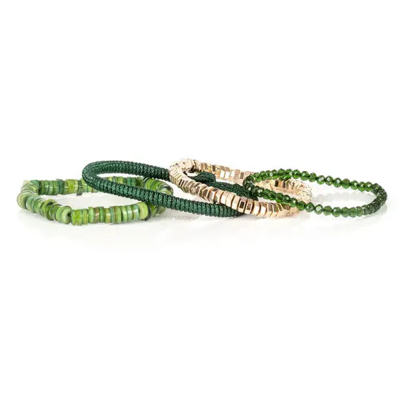 Layered men’s bracelet set featuring green shell heishi beads, faceted dark green crystal beads, gold-tone hematite cube beads, and a braided green cord bracelet, displayed on a white background.