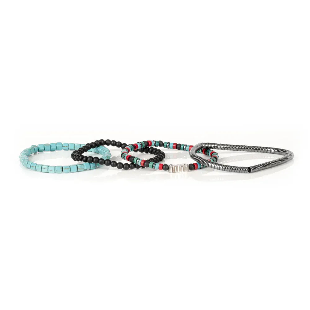 Layered men’s bracelet set featuring turquoise cube beads, black matte stone beads, silver-tone hematite beads, colorful accent beads, and a crystal pavé bat centerpiece, displayed on a white background.