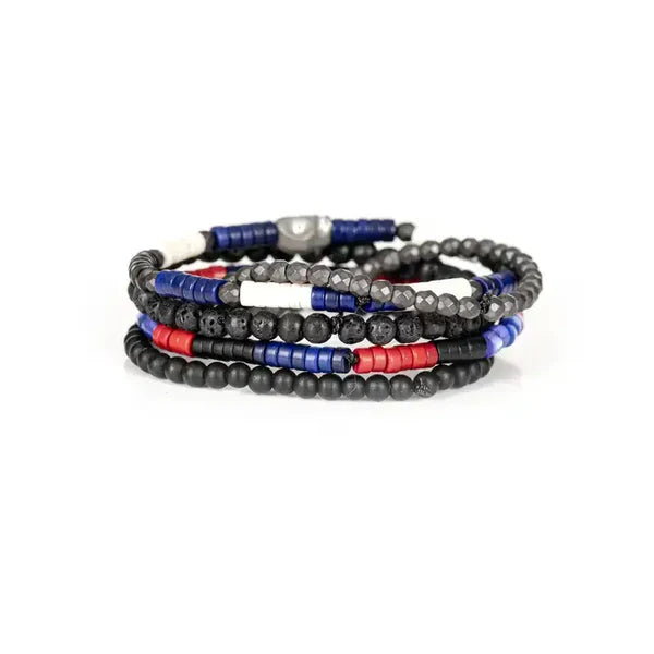 Layered men’s bracelet set featuring black matte beads, lava stone beads, faceted hematite beads, and red and blue accent beads with a silver-tone centerpiece, displayed on a white background.