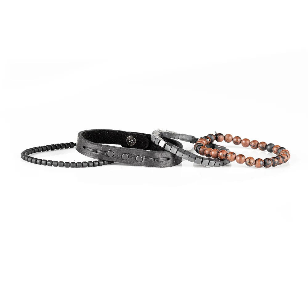 Men's handcrafted black leather wrap bracelet set featuring brown mahogany obsidian gemstone beads, matte black hematite cube beads, black seed beads, and a premium layered leather cuff with stitched detailing. Luxury men's bracelet stack photographed on a clean white background.