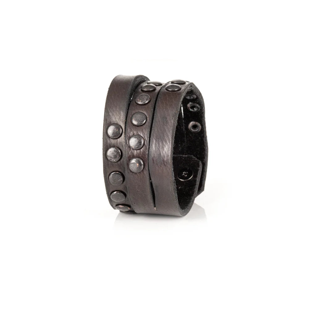 Black genuine leather wrap bracelet featuring layered leather bands with black rivet detailing and a handcrafted rugged design, displayed on a white background.