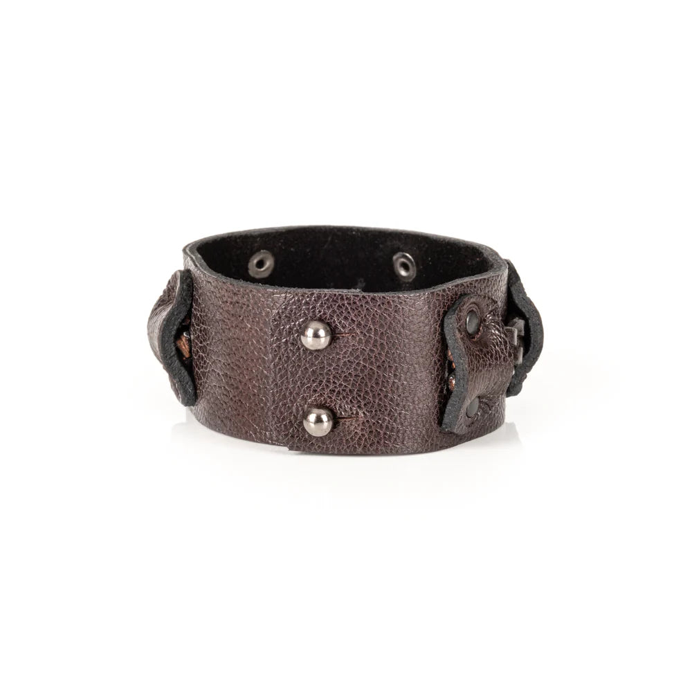 Men's handcrafted genuine leather cuff bracelet in dark brown featuring a wide leather band with a braided leather center strap, matte black rivet accents, and premium artisan craftsmanship. Luxury men's leather wristband photographed on a clean white background.