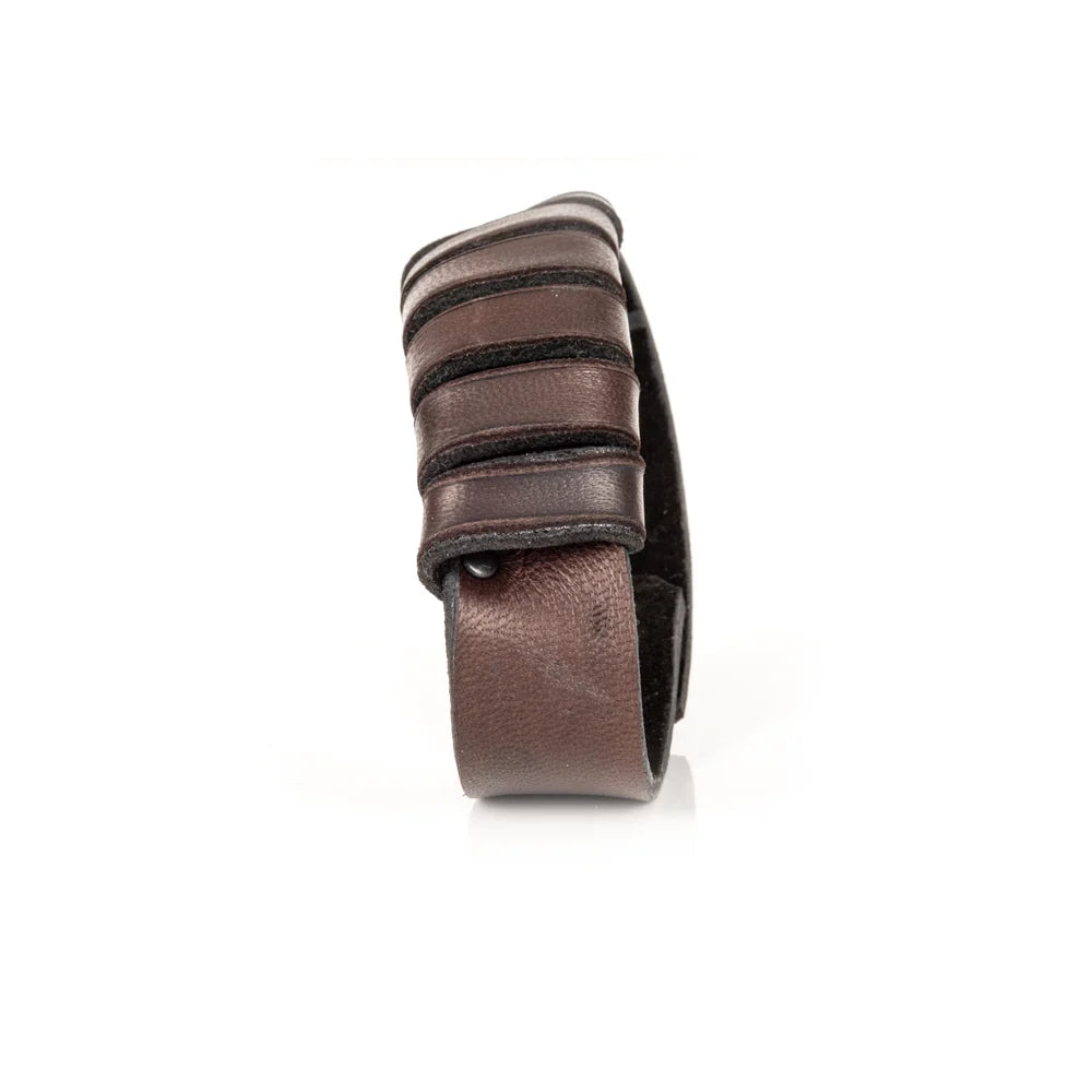 Men's handcrafted genuine leather cuff bracelet in dark brown featuring layered horizontal leather bands with a rugged stacked design and premium artisan craftsmanship. Luxury men's leather wristband photographed on a clean white background.