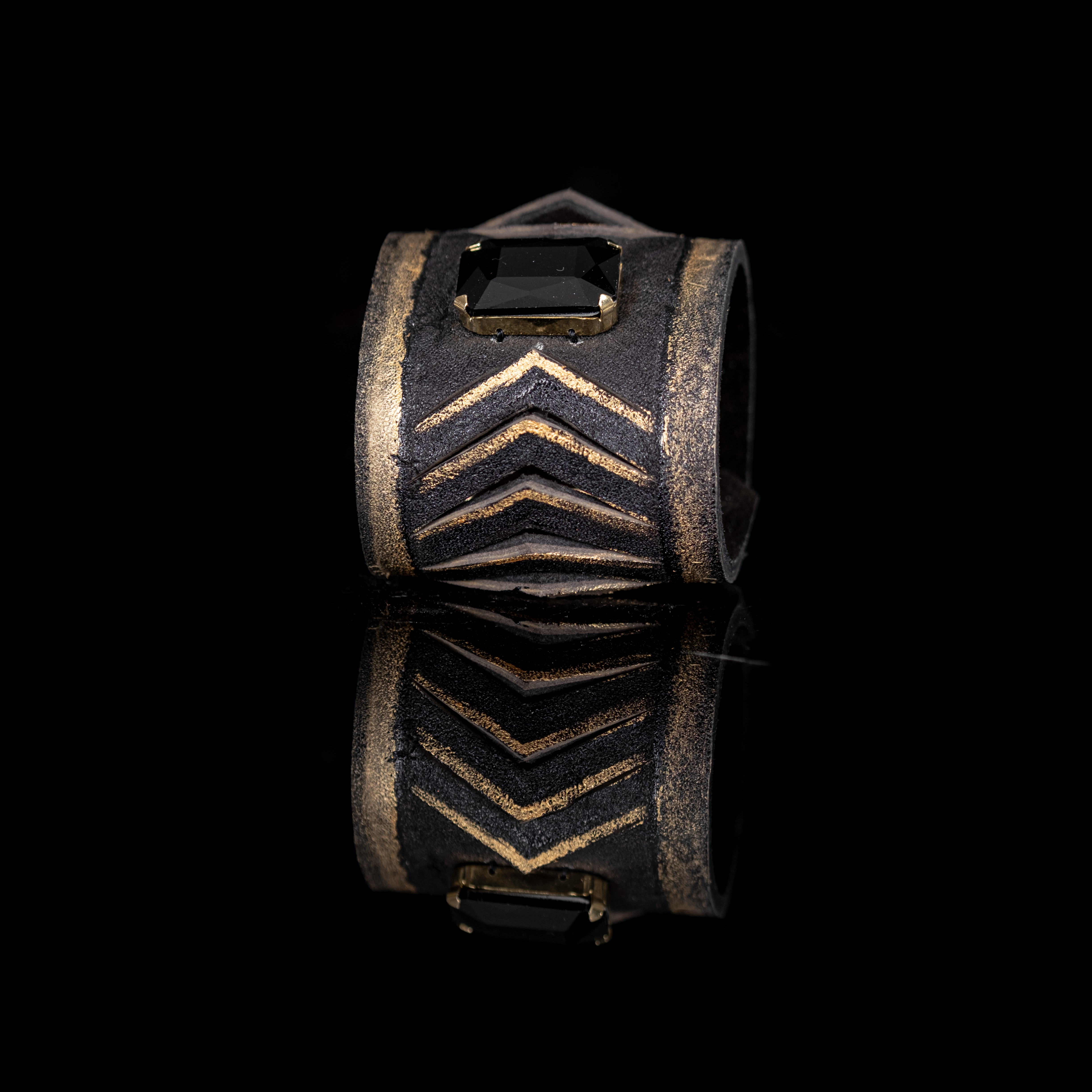 Black leather cuff bracelet with gold chevron detailing and rectangular black crystal centerpiece, handmade statement bracelet by THE DARK
