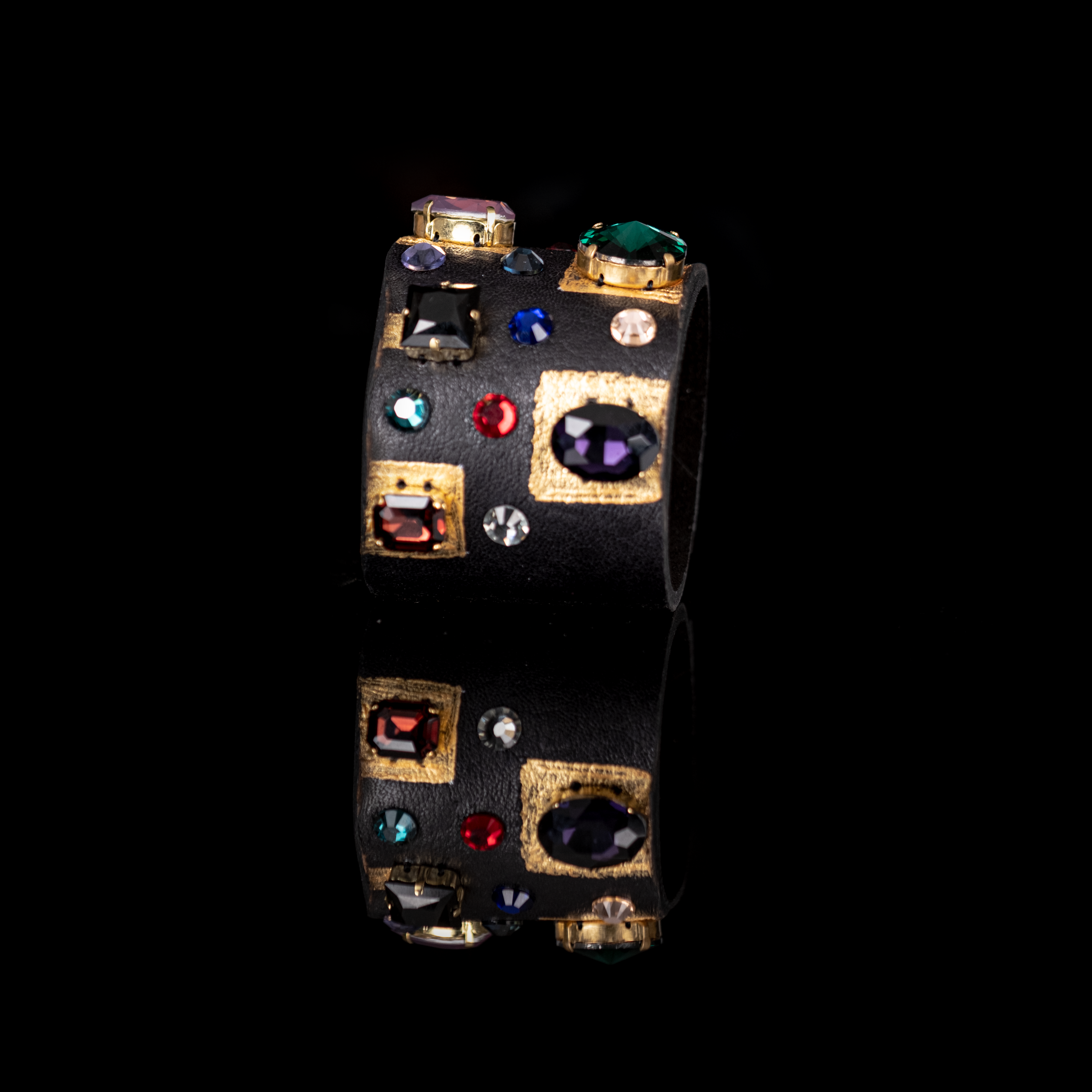 Black leather cuff with gold accents and multicolor geometric crystals, bold statement bracelet
