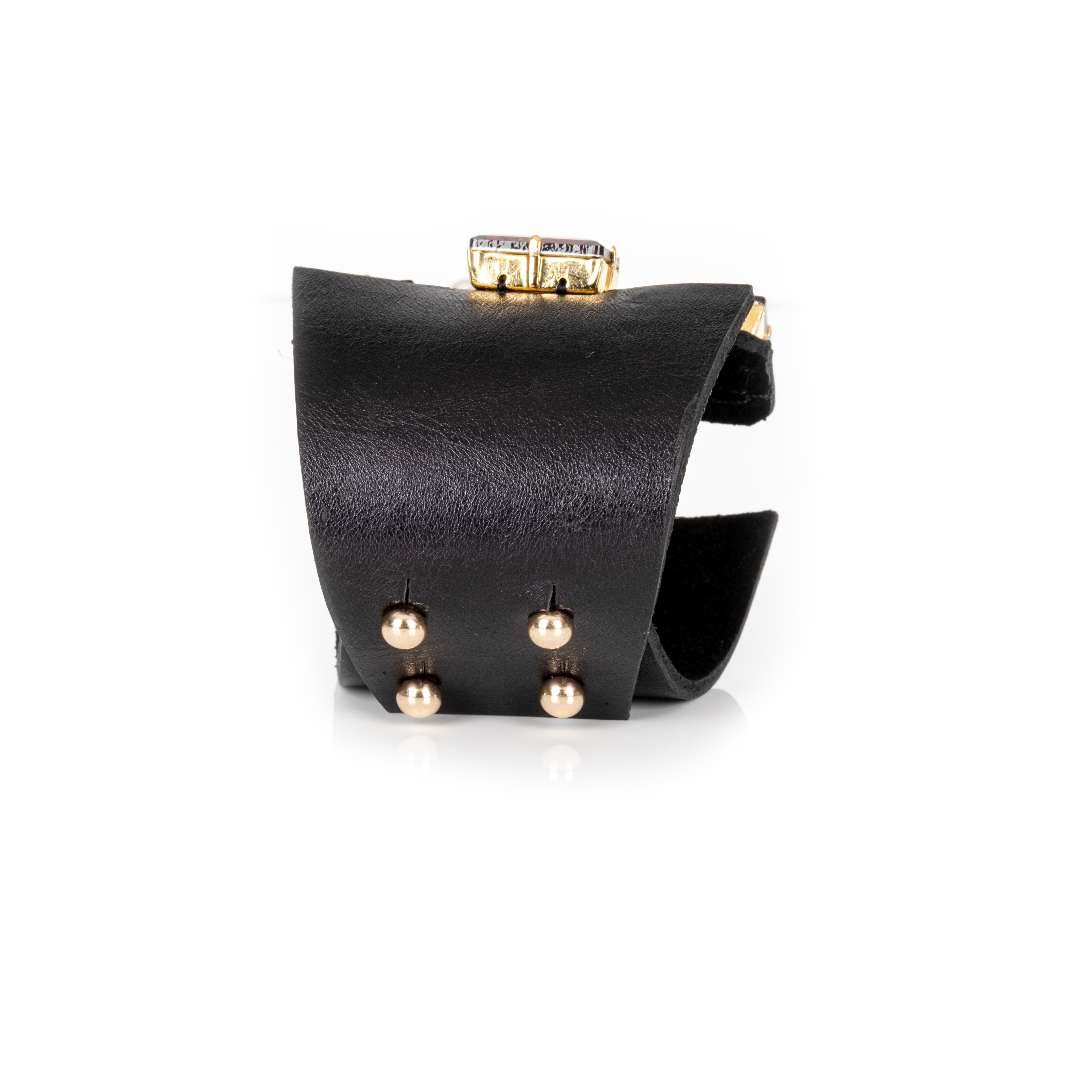 Black leather cuff with emerald green center stone, red crystals, and pearl detailing, statement bracelet