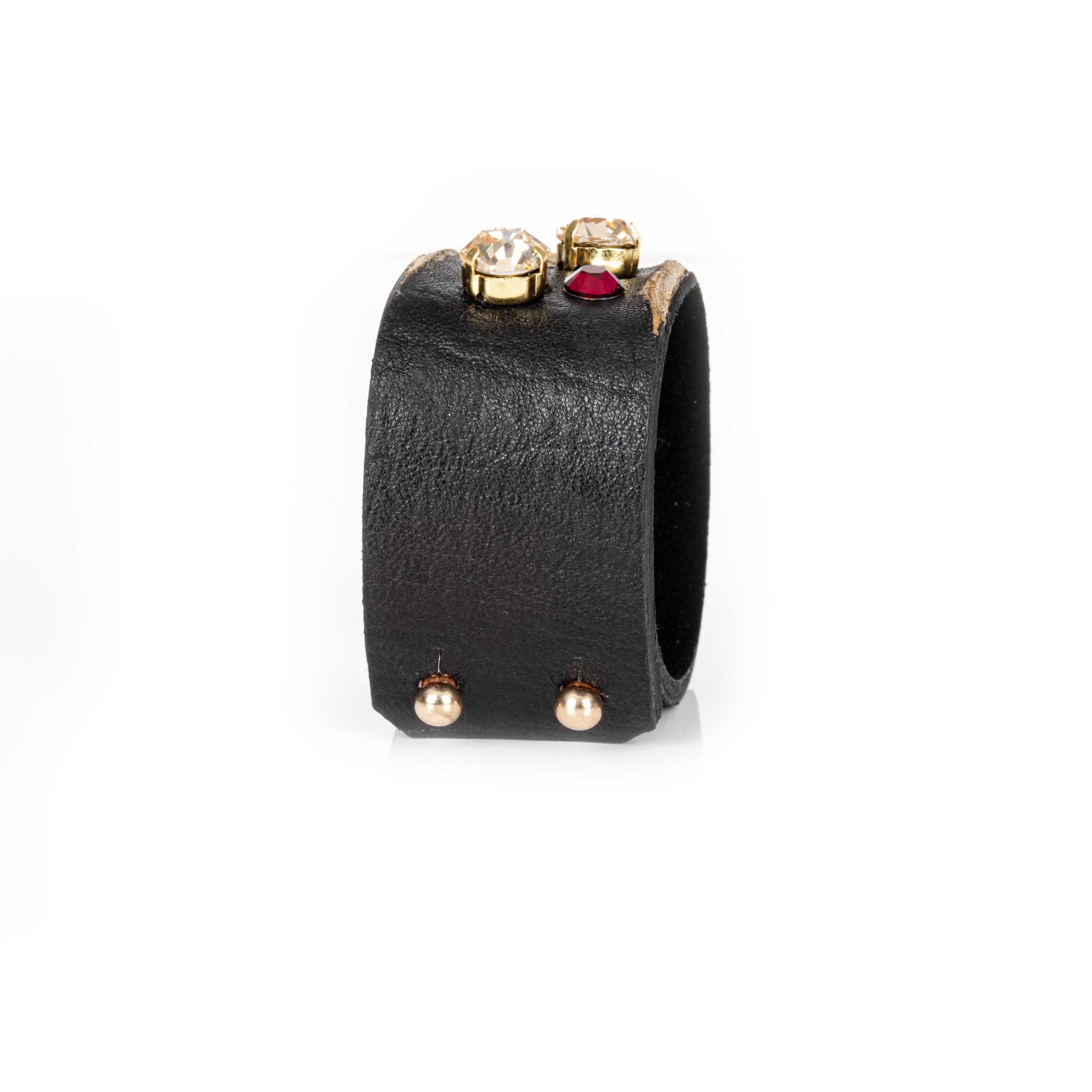 Black leather cuff with gold edges and scattered multicolor crystals, minimalist statement bracelet