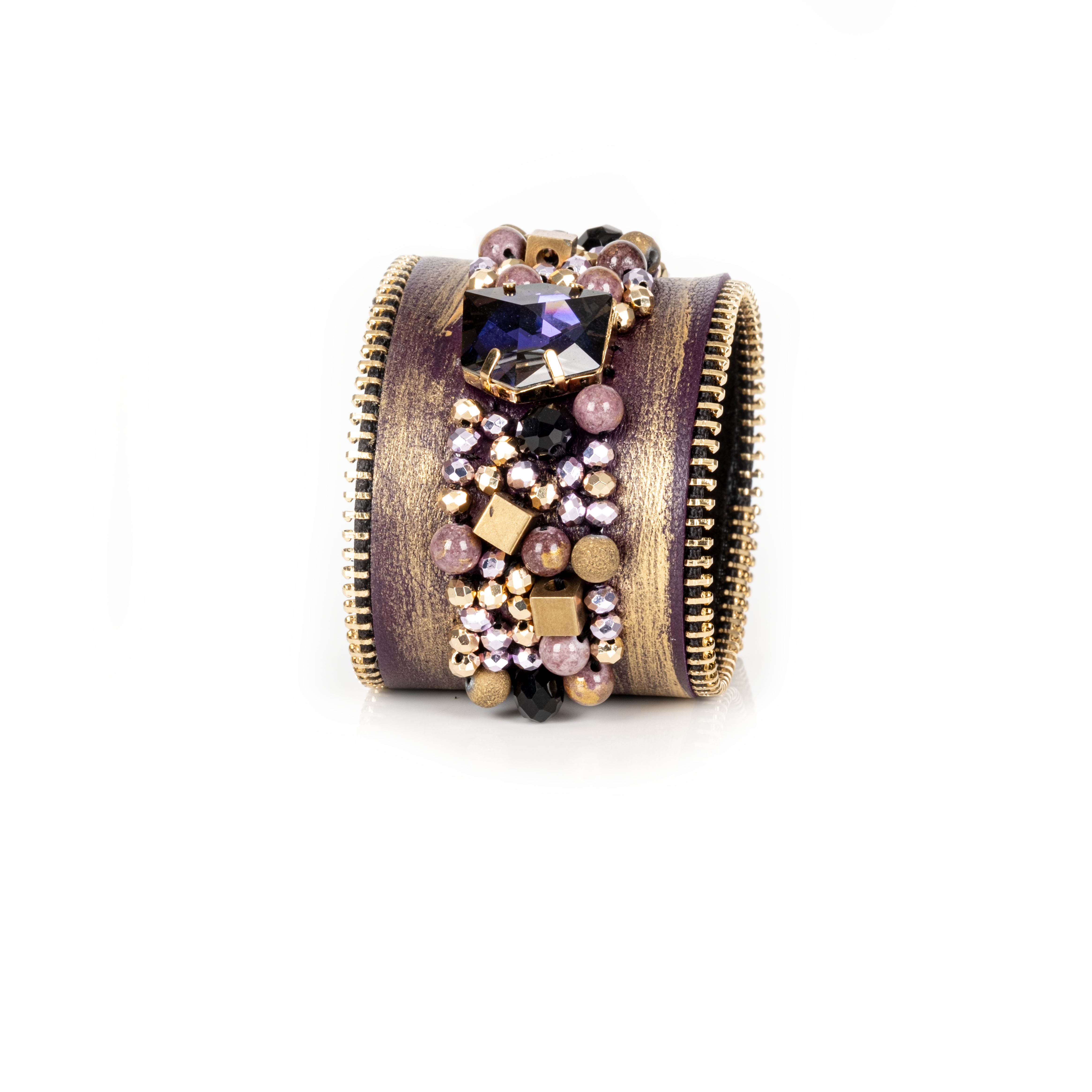 Gold brushed leather cuff with zipper edges and central crystal cluster embellishment, statement bracelet