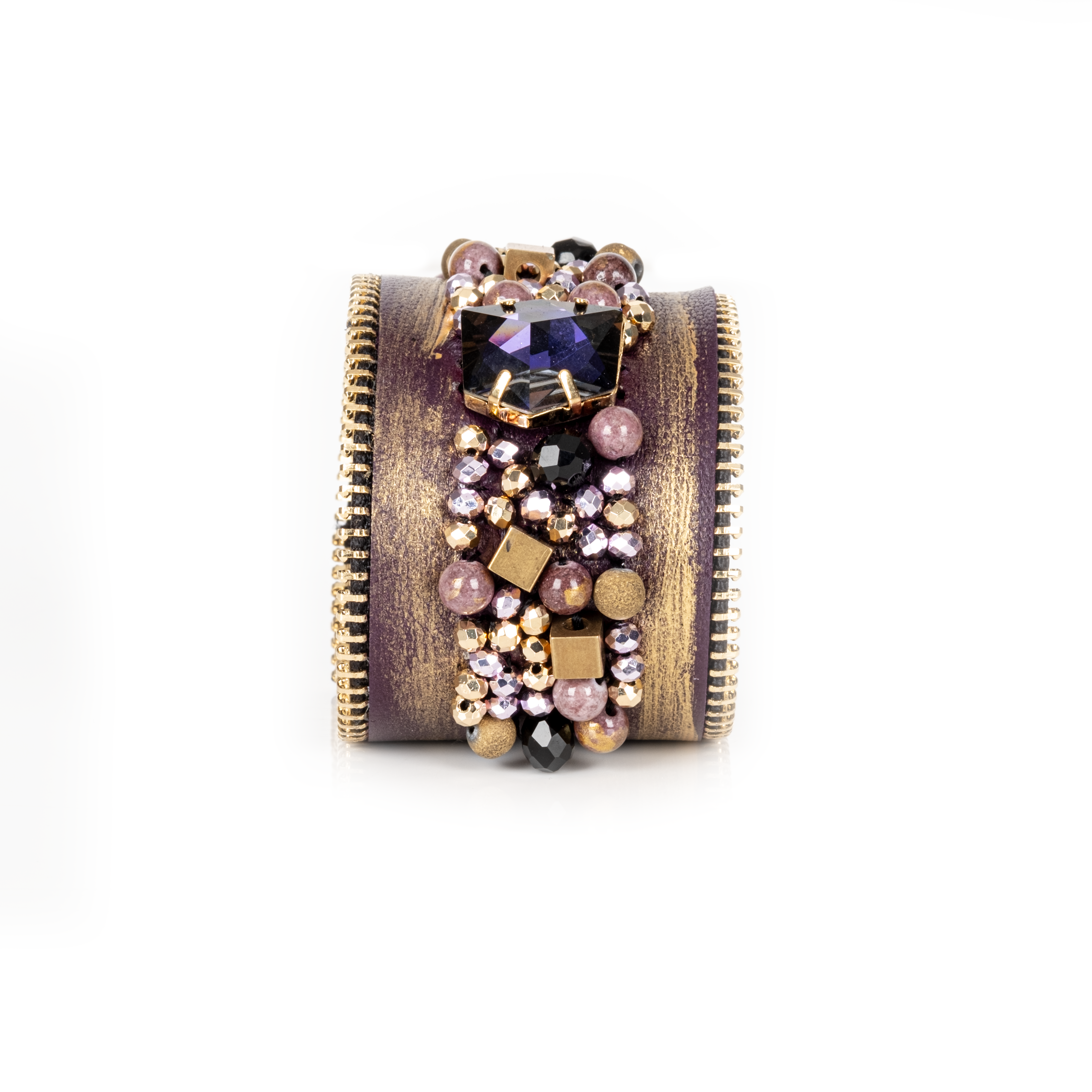 Gold brushed leather cuff with zipper edges and central crystal cluster embellishment, statement bracelet