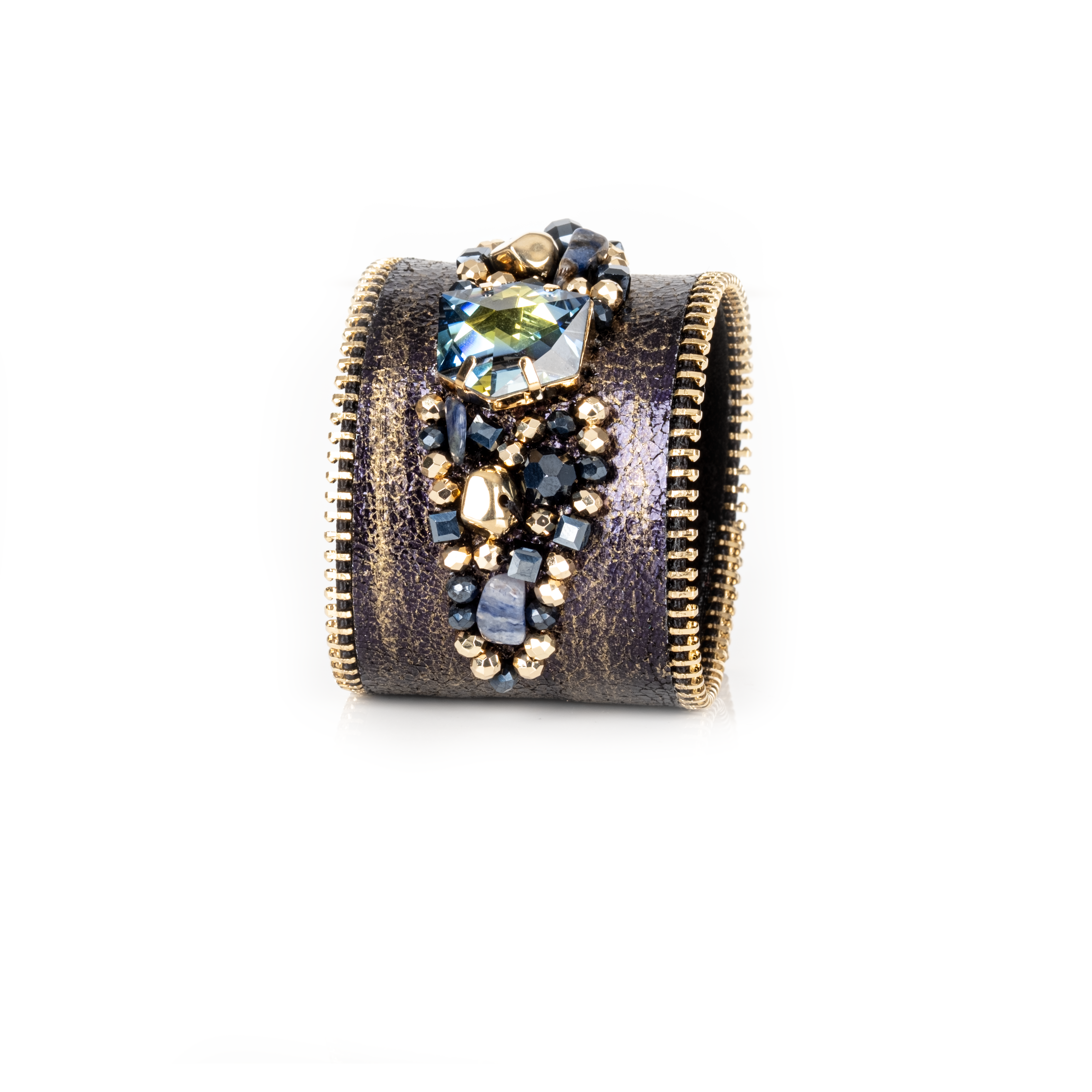 Dark leather cuff with gold brushed finish, zipper edges and blue-toned crystal cluster centerpiece