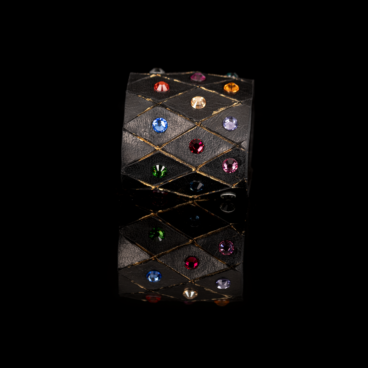 Black leather cuff bracelet with multicolor crystals and geometric stitched pattern, wide statement bracelet for women
