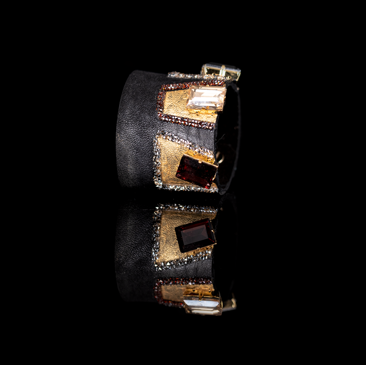 Black leather cuff bracelet with geometric gold panels and champagne and garnet crystals, handmade statement bracelet by THE DARK