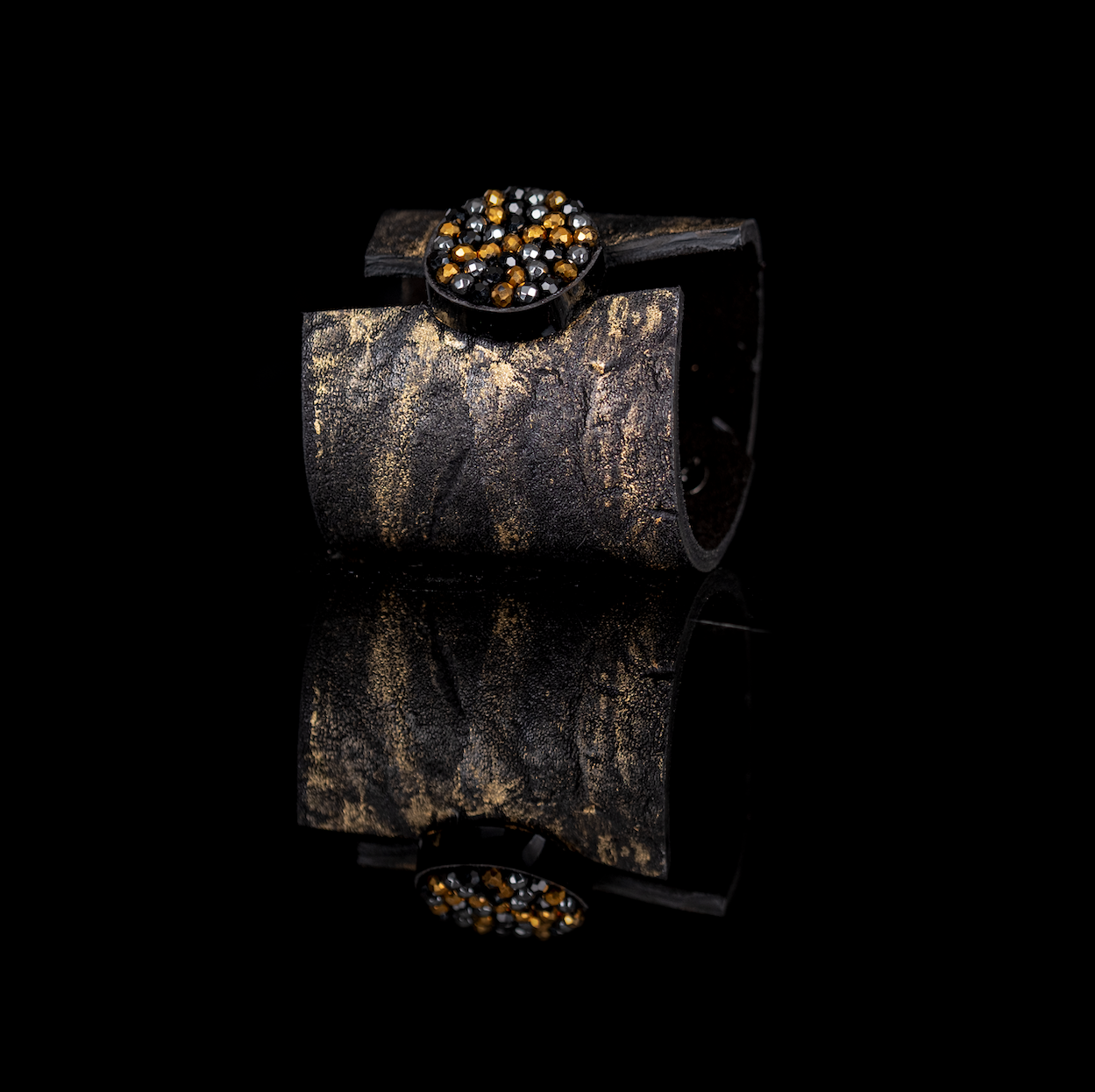 Black leather cuff bracelet with gold brushed texture and round black and gold crystal cluster centerpiece, handmade bracelet by THE DARK