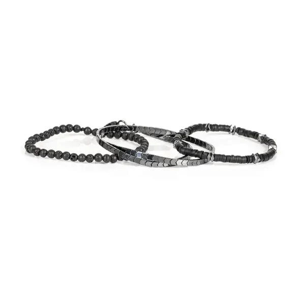 Set of three black beaded bracelets on a white background