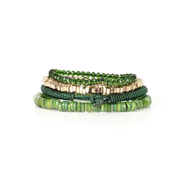 Layered men’s bracelet set featuring green shell heishi beads, faceted dark green crystal beads, gold-tone hematite cube beads, and a braided green cord bracelet, displayed on a white background.